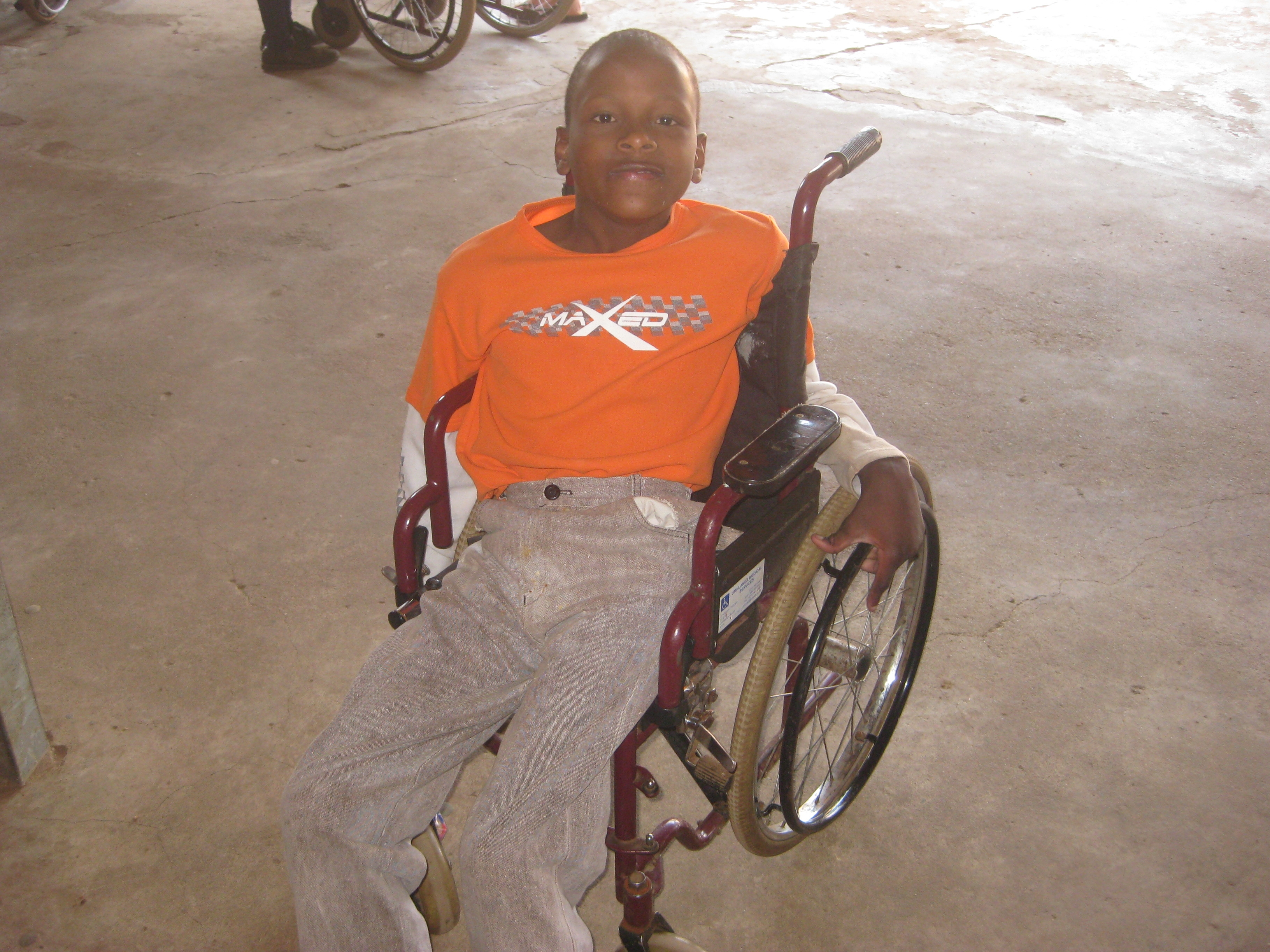 little boy in wheelchair